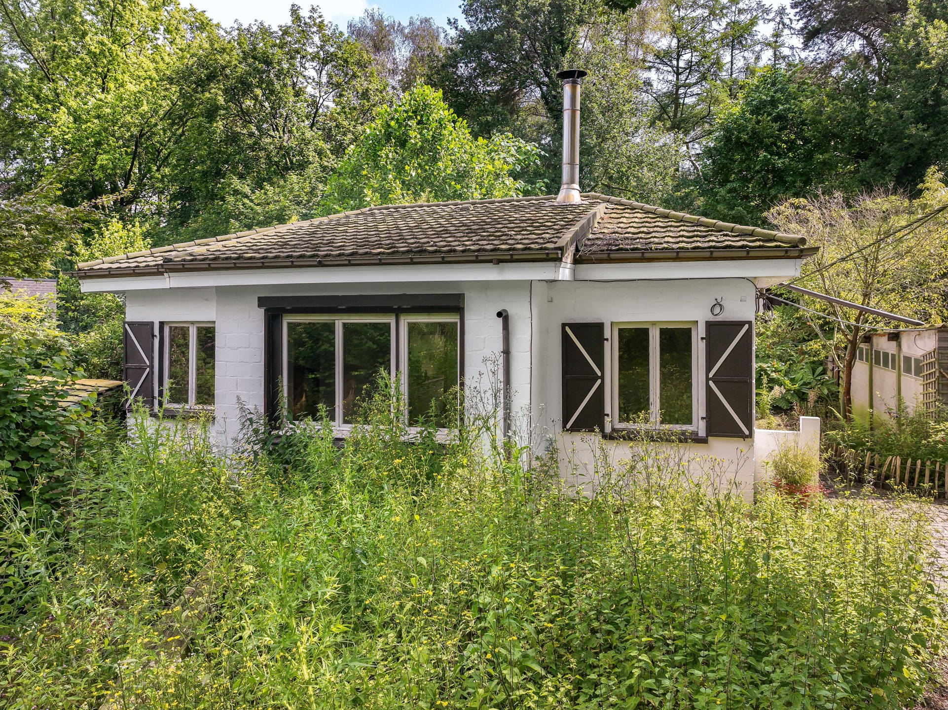 Bouwgrond met Exotische Tuin en Vele Mogelijkheden foto 9