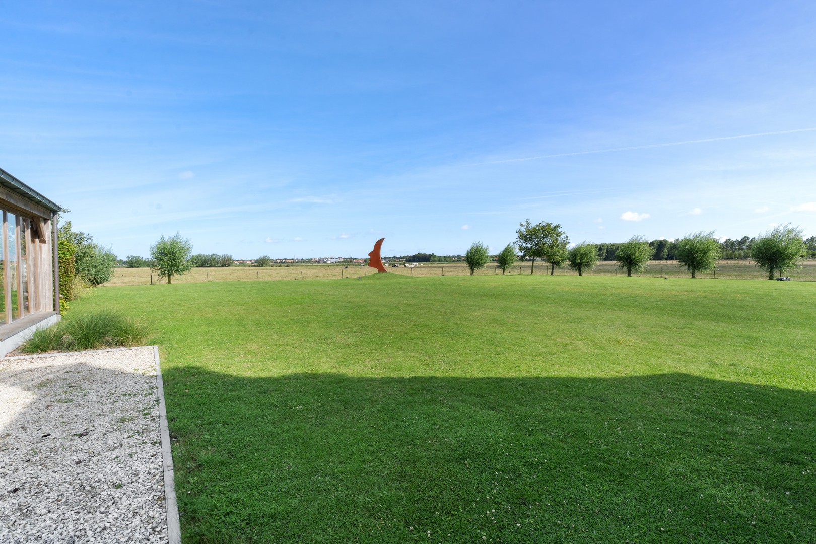 Hedendaagse villa gelegen op een terrein van 2.648m² genietend van open zicht over de Polders. foto 7