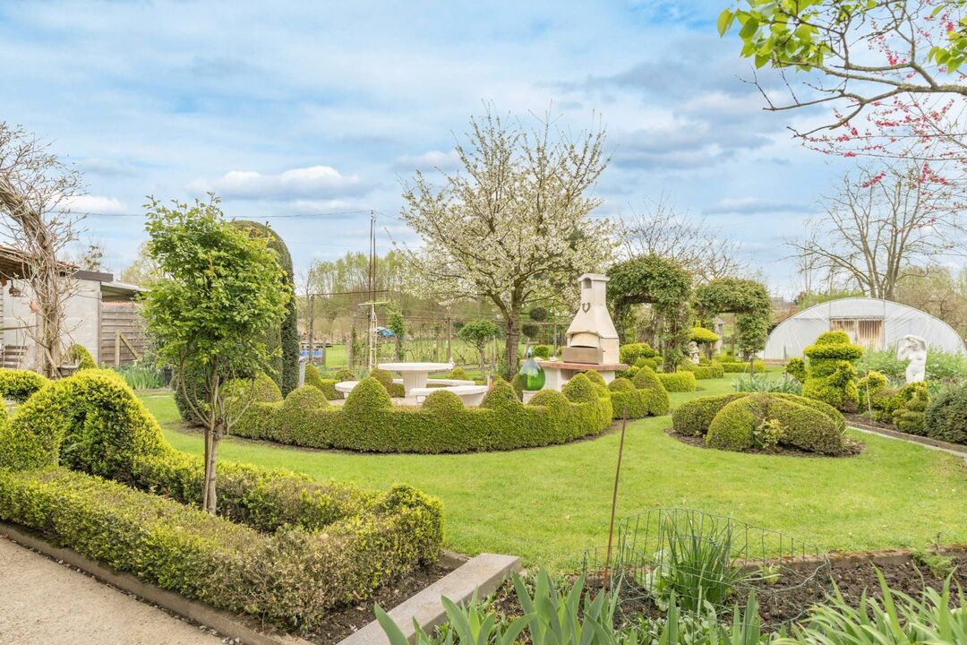 Karaktervolle woning met heerlijke tuin met zicht op de achterliggende groene omgeving, op een prachtig perceel van 20a 24ca foto 30
