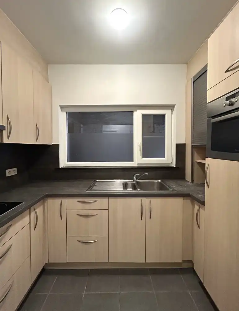 Instapklaar gelijkvloers 1-slaapkamerappartement met ruim terras in Leuven foto 7