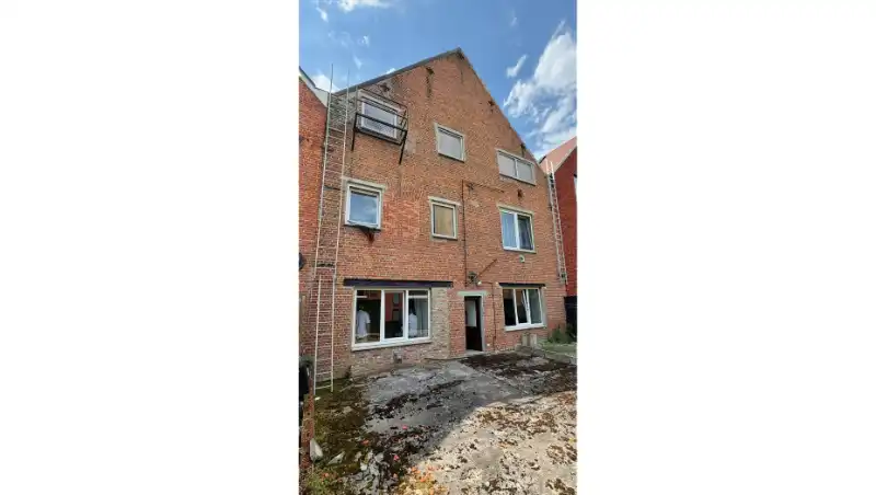 Opbrengsteigendom met 7 appartementen + ruime garage-magazijn 150m² foto 21