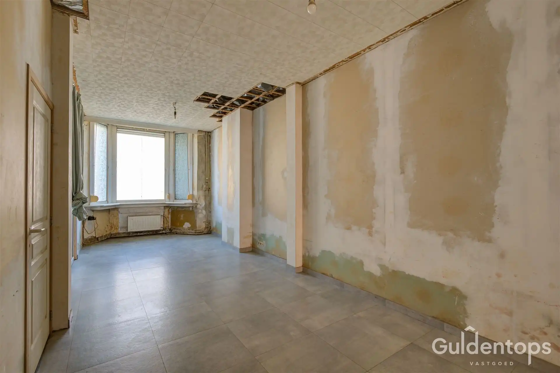 Te renoveren gezinswoning met 3 slaapkamers en grote tuin. foto 7
