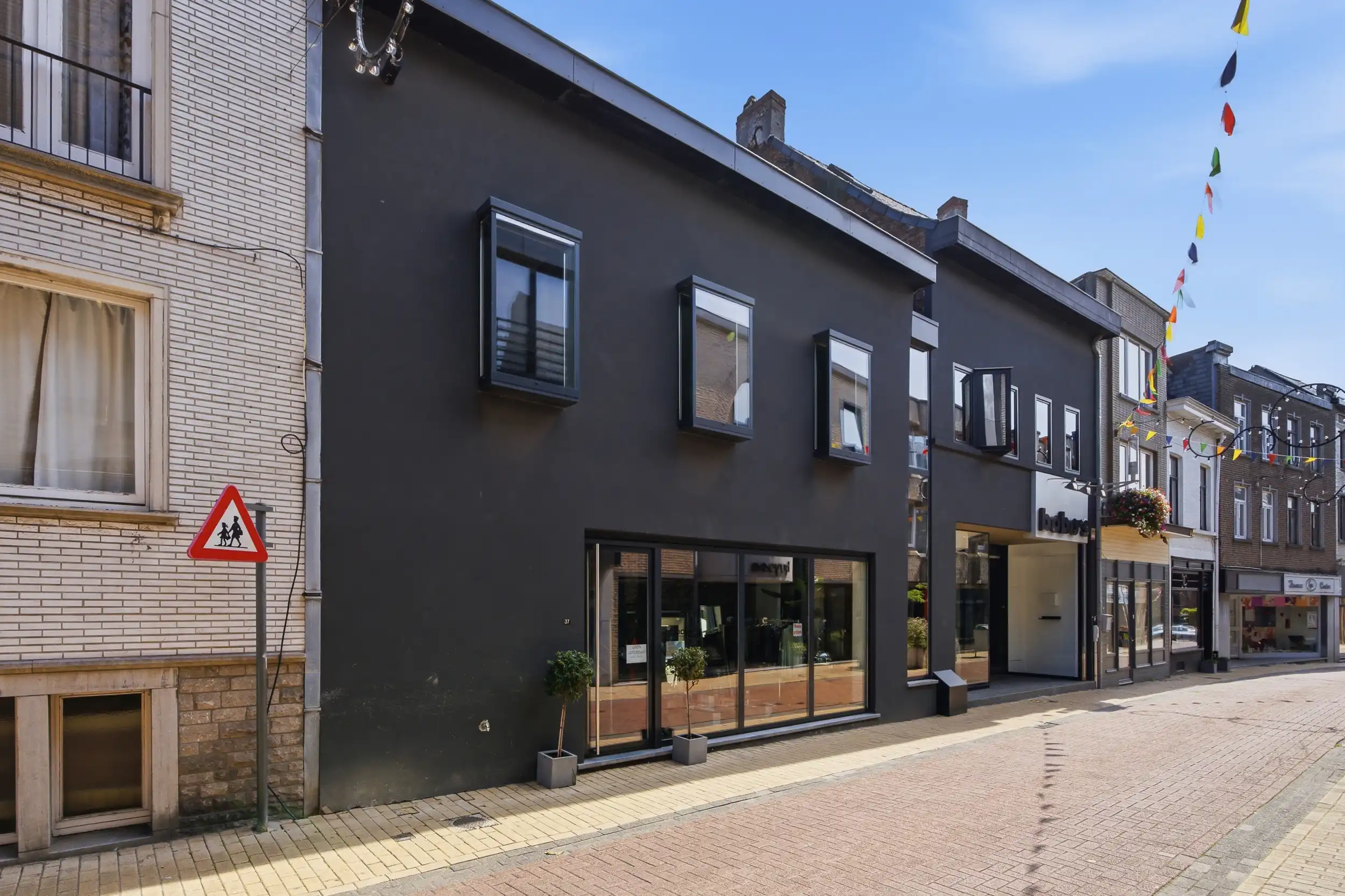 Uniek handelspand met duplex app. en tuin in hartje Wetteren foto 26