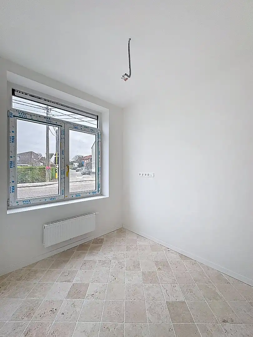 Elegant wonen in Tienen: gerenoveerde rijwoning met 3 slaapkamers en zuidwestgerichte tuin. foto 4