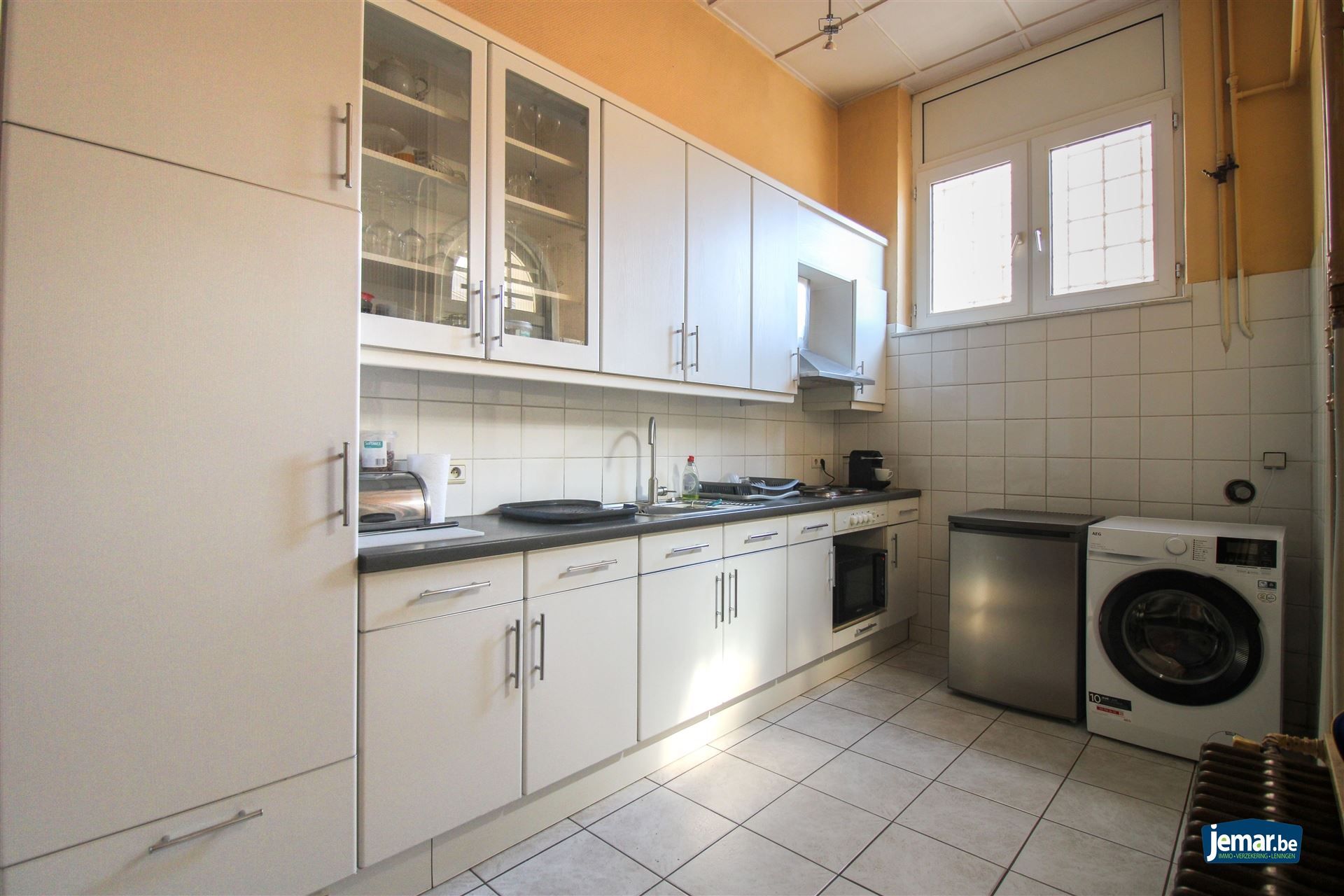 Karaktervol handelspand met woonst op toplocatie – ideaal om wonen en werken te combineren in het hart van Maasmechelen! foto 6