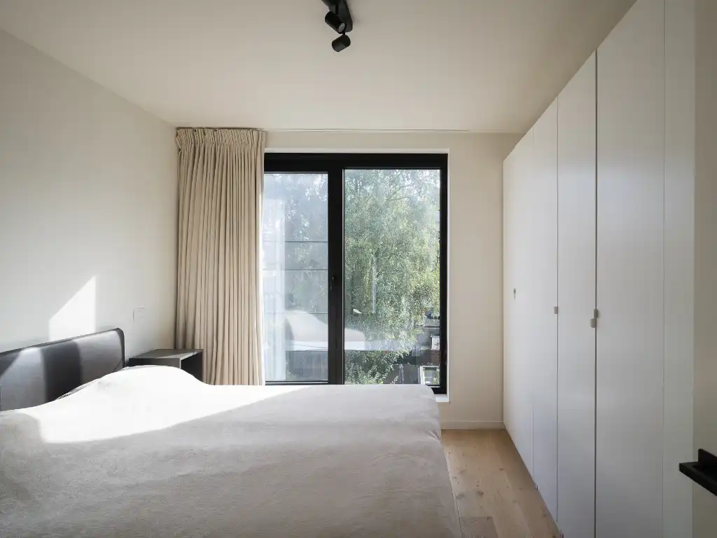 Lichtrijk appartement met twee volwaardige slaapkamers en zonneterras nabij het Baudelopark. foto 13