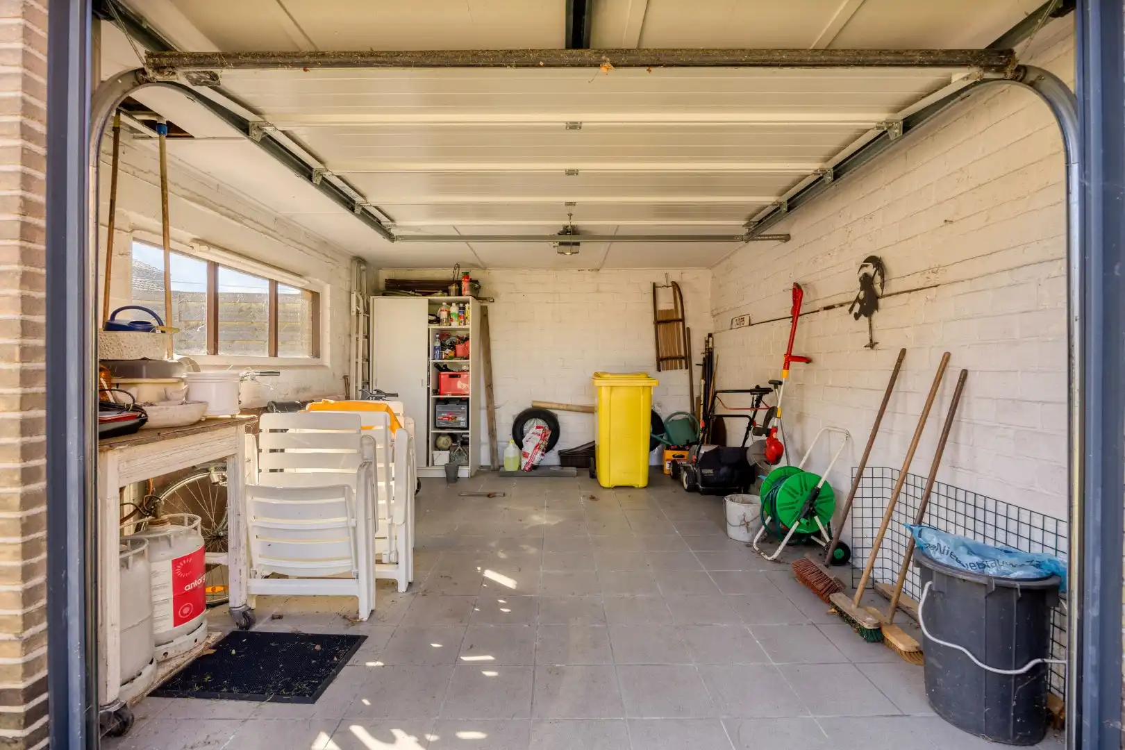 Rustig gelegen op te frissen gelijkvloers woning. foto 23
