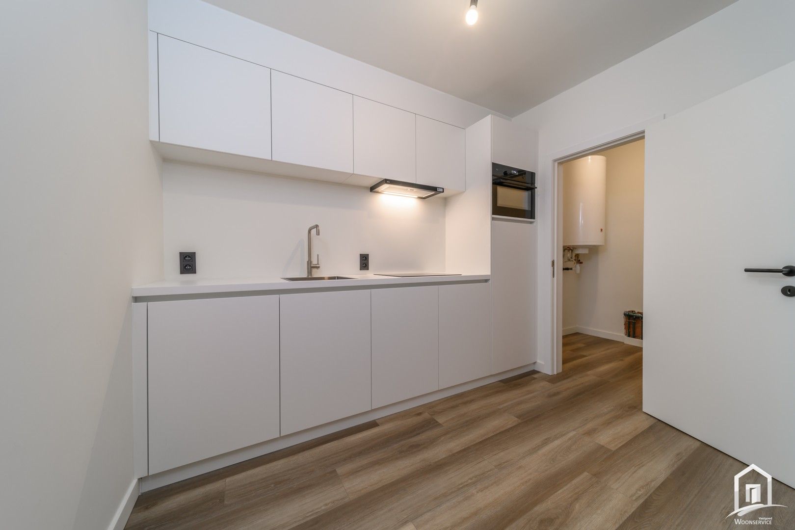 Totaal gerenoveerd gelijkvloers-appartement met tuintje foto 8