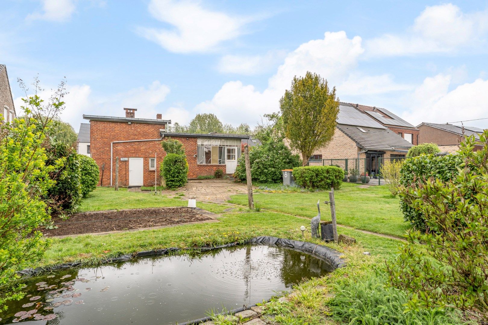 Te renoveren vrijstaande woning op een gunstig gelegen perceel van 12a 07ca vlakbij het centrum foto 33