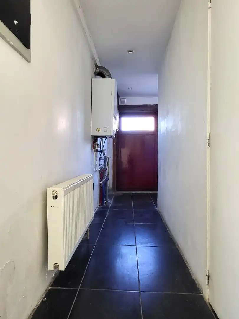 Halfopen bebouwing met 3 slaapkamers en zonnig tuintje in rustige dorpskern. foto 21
