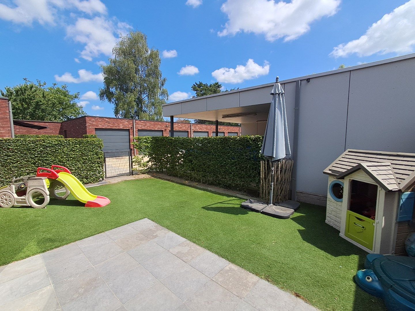 Ruim gelijkvloers appartement met tuin en carport! foto 15