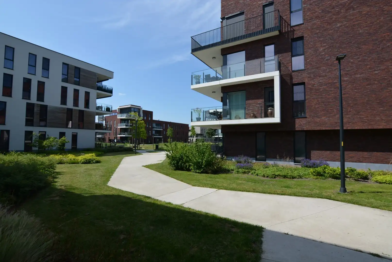 Modern, energiezuinig appartement met 2 slpks, terras, autostaanplaats en kelderberging. foto 21