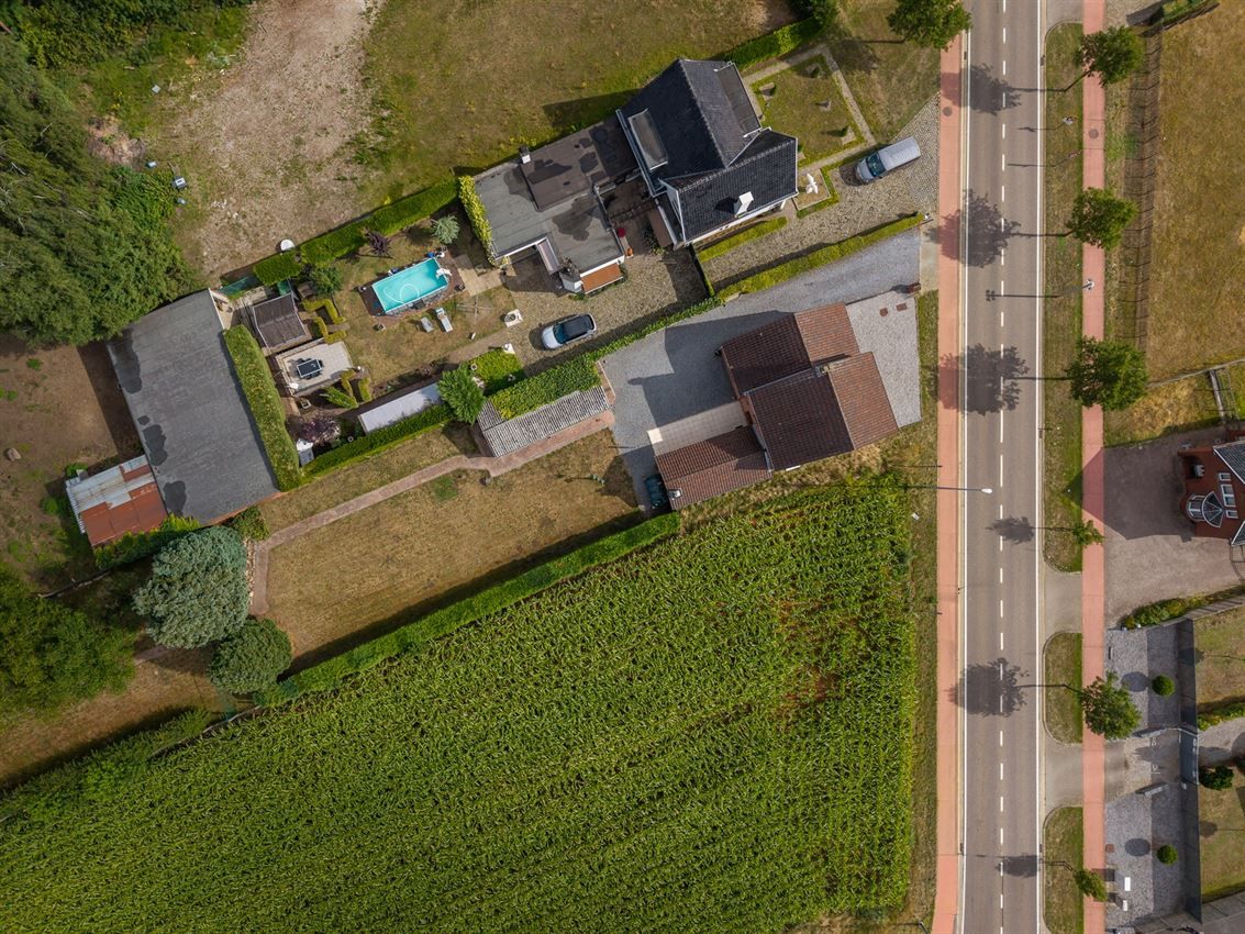 Vrijstaande woning met 3slk op 22a40ca op strategische ligging foto 35