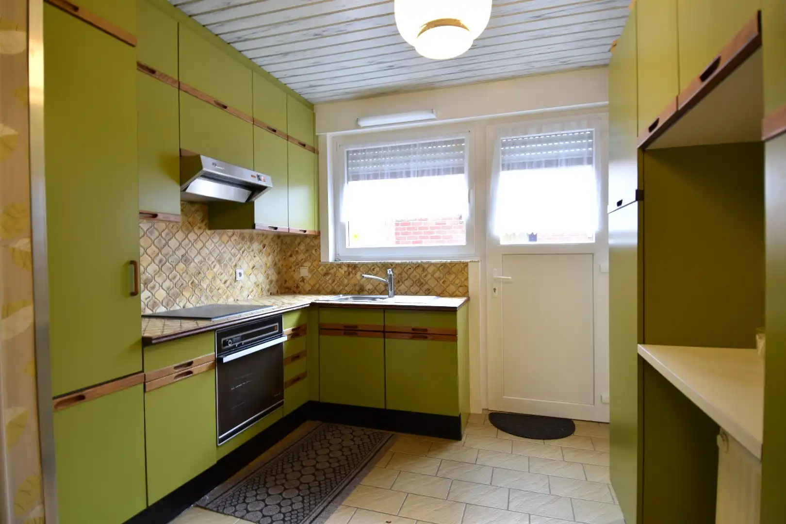 Woning op hoekperceel met 3 slaapkamers, garage en zalige tuin te koop in Gullegem foto 4