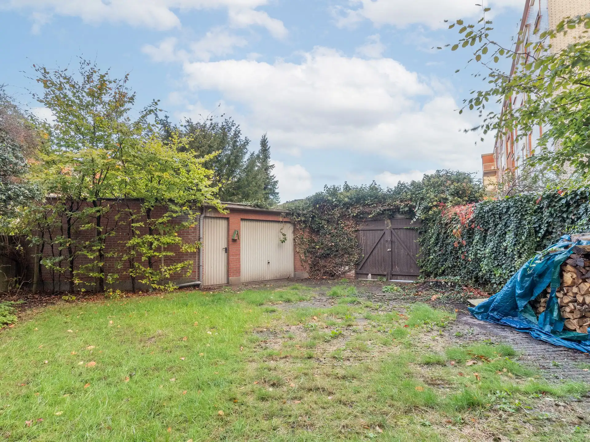 Een exclusief ruim duplex appartement met tuin en garagebox foto 19