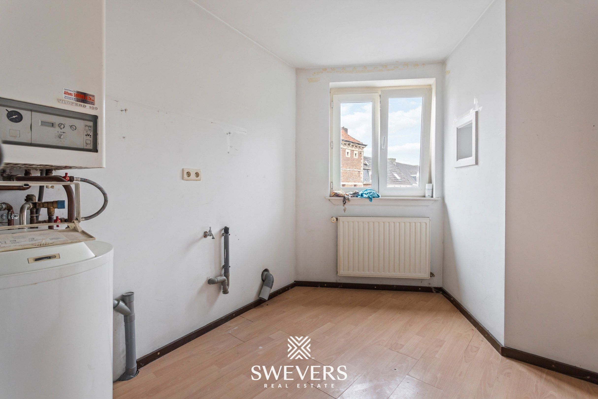 Charmante hoekwoning met potentieel in hartje Tongeren foto 13