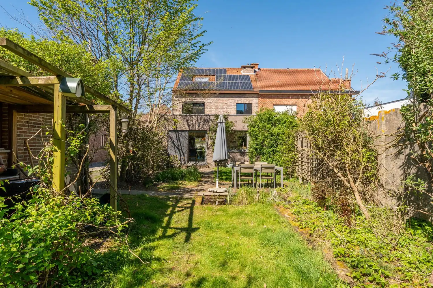 Goed gelegen en energiezuinige woning met 4 slaapkamers, een oprit met een garage en een tuin op de grens van Kessel-Lo en Holsbeek! foto 12