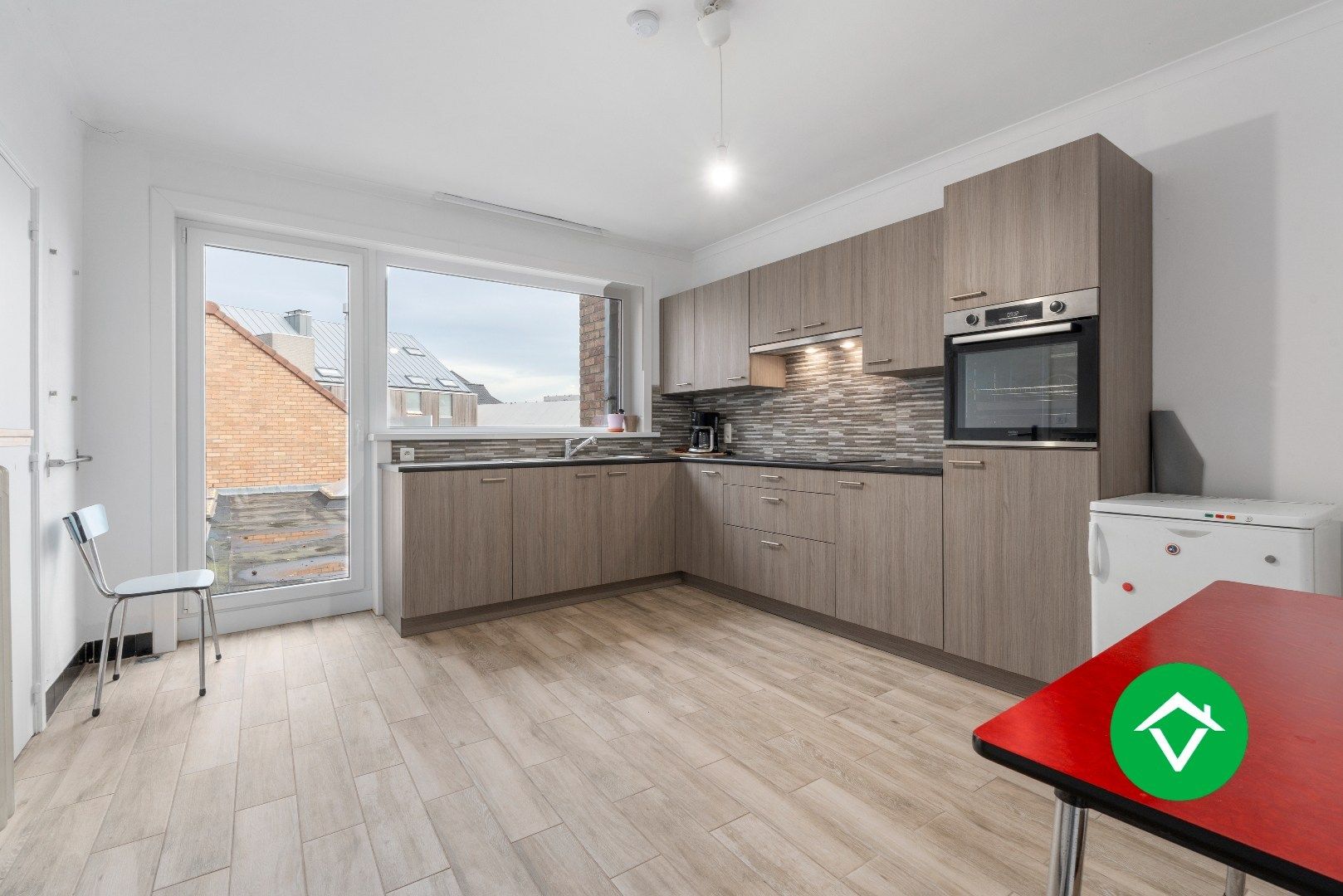 Veelzijdig handelspand met woonst en twee verhuurde appartementen in centrum Aartrijke foto 23