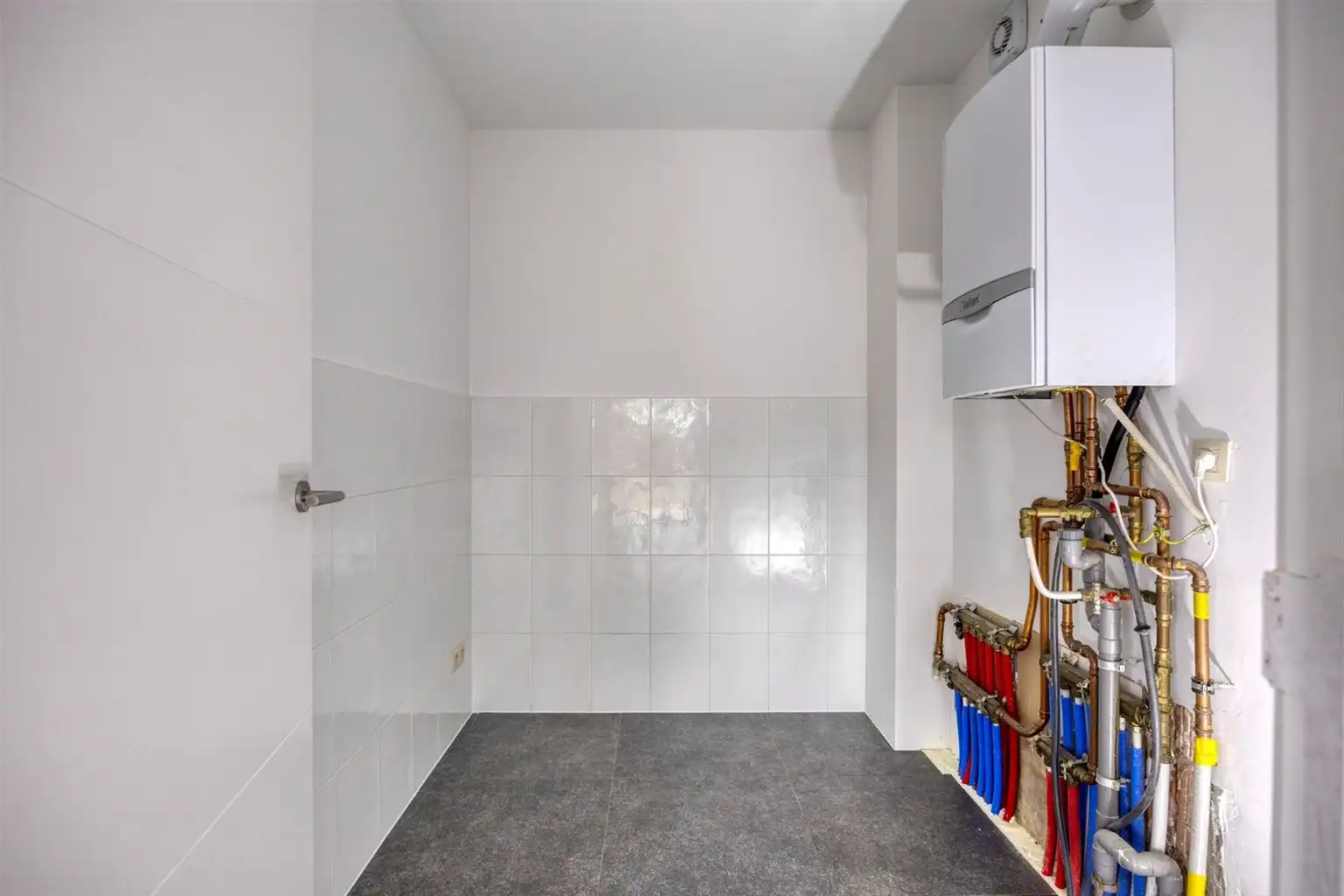 Instapklaar gelijkvloers appartement met 2 slaapkamers, ruime tuin en parkeergelegenheid op een rustige toplocatie in Opitter.  foto 21