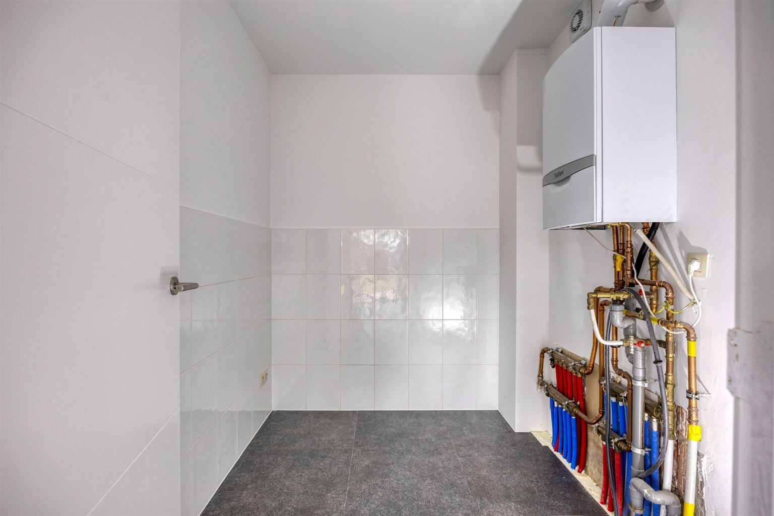 Instapklaar gelijkvloers appartement met 2 slaapkamers, ruime tuin en parkeergelegenheid op een rustige toplocatie in Opitter.  foto 21