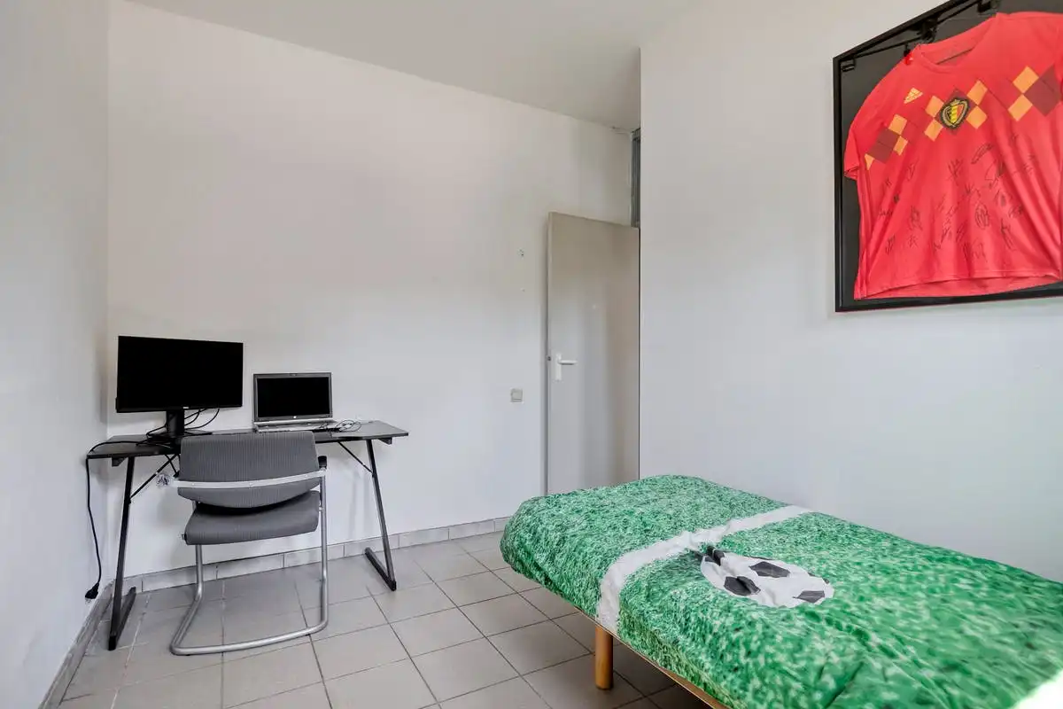 Gelijkvloers appartement op uitstekende ligging in Humbeek met tuin en parkeermogelijkheden foto 12