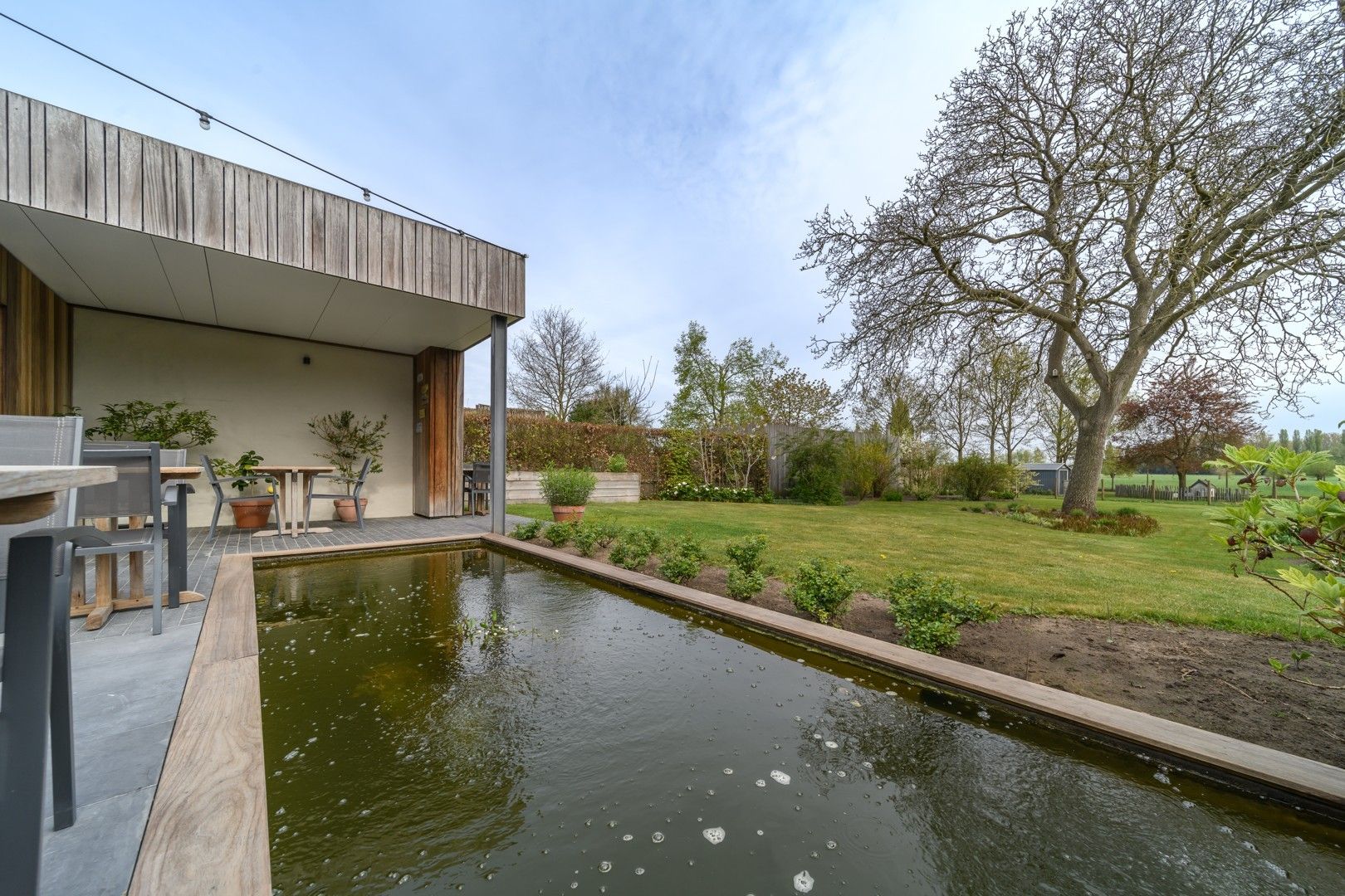 Charmant woonhuis  + achterliggend stuk bouwgrond op landelijke toplocatie foto 2