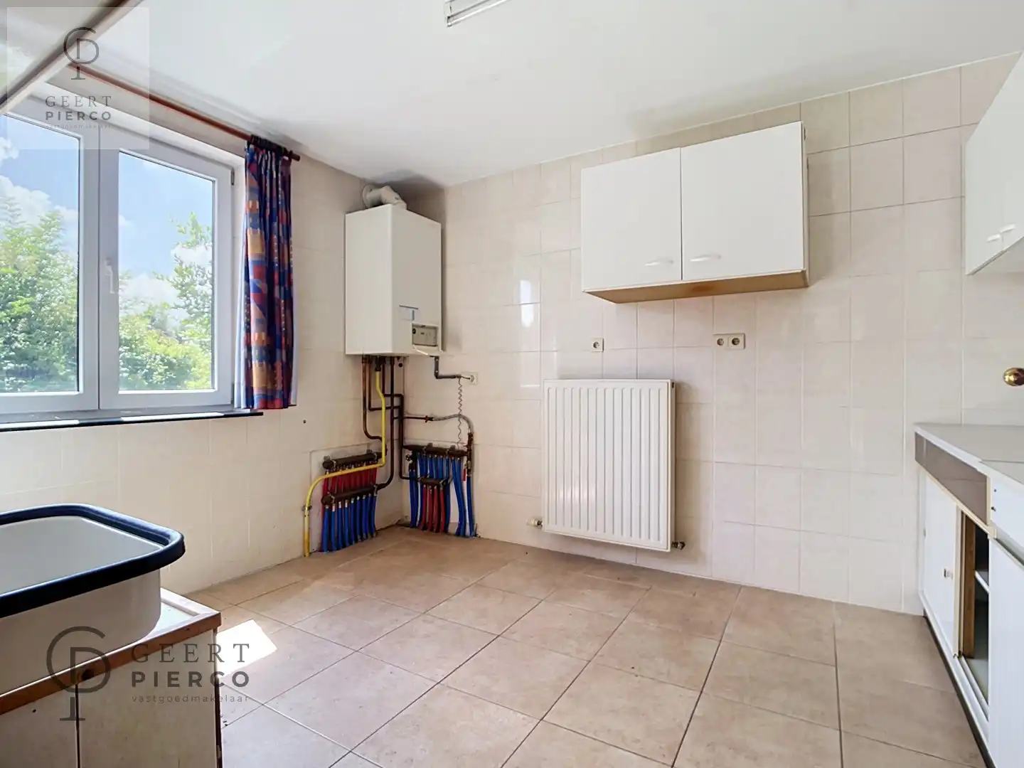 Instapklaar gelijkvloers appartement met garagebox en tuin in Landen foto 10