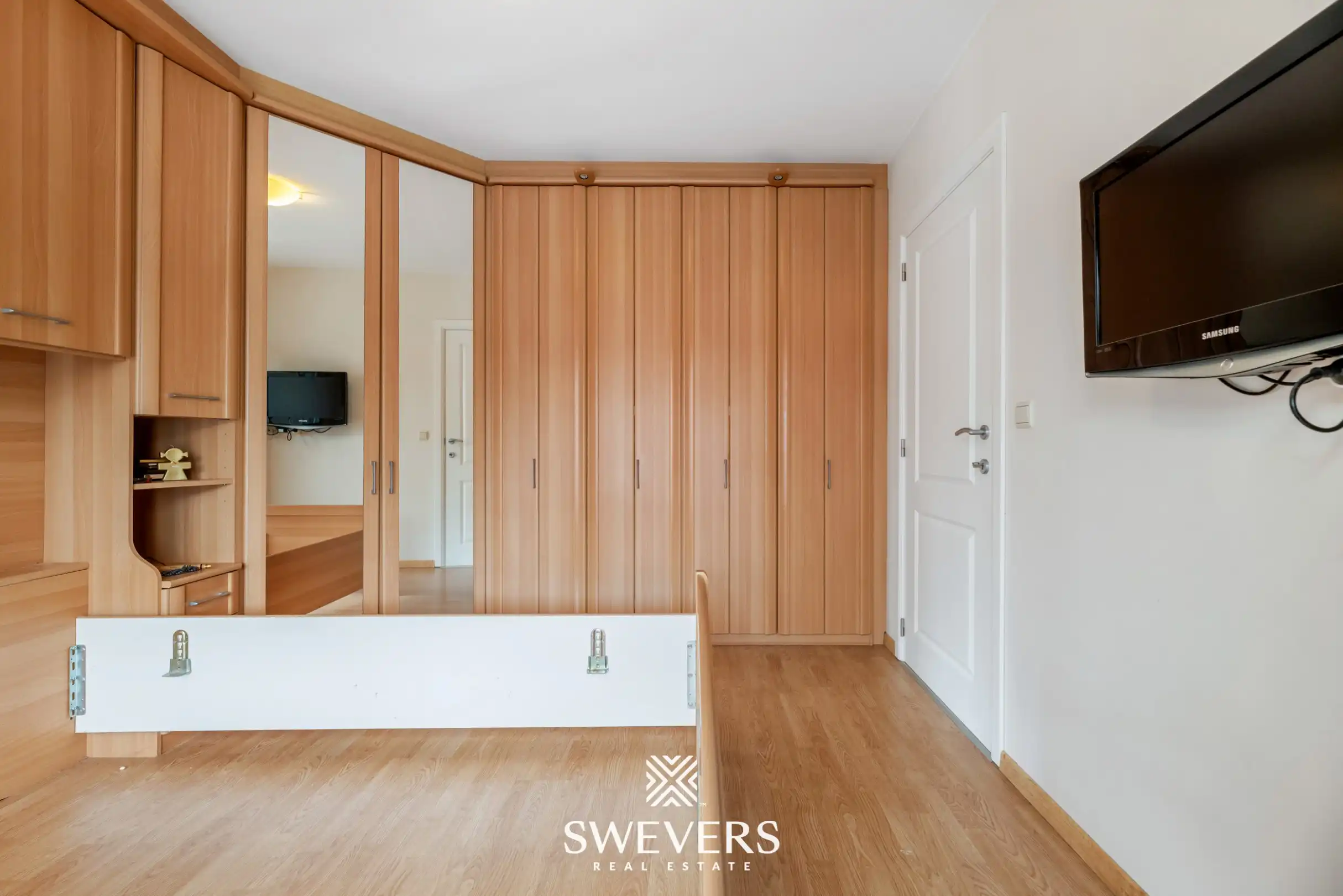 Ruim gelijkvloers appartement met tuin en ondergrondse autostaanplaats foto 16