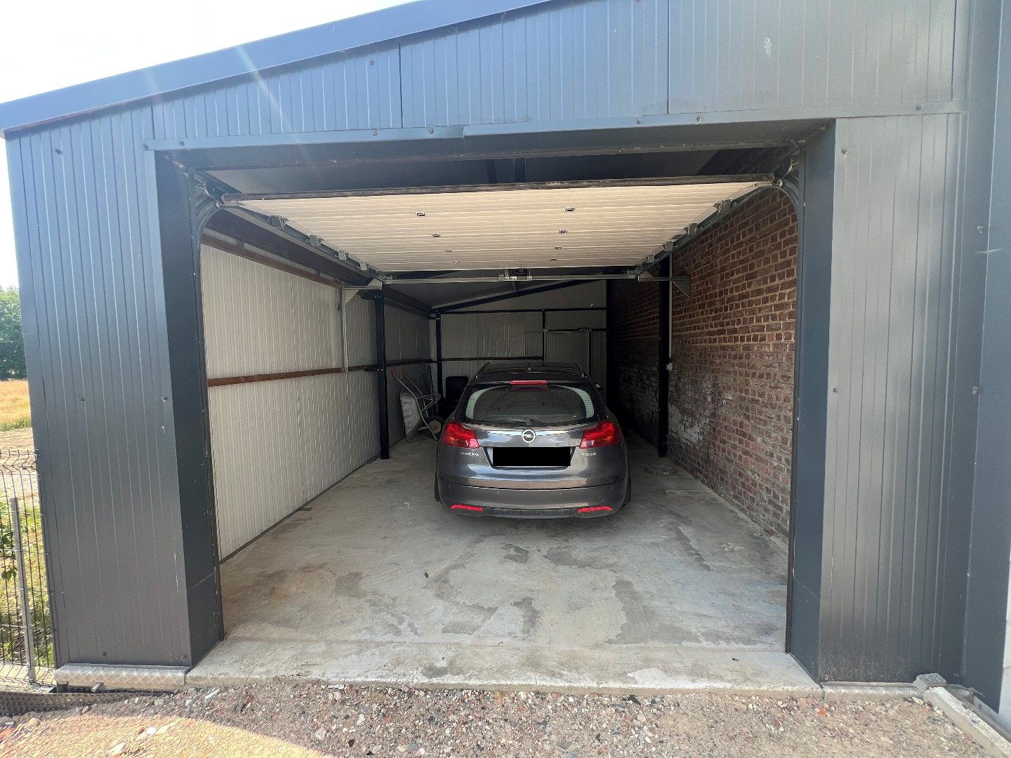 Opgefriste, ruime woning met 4 slpks, garage, carport, terras en tuin foto 16