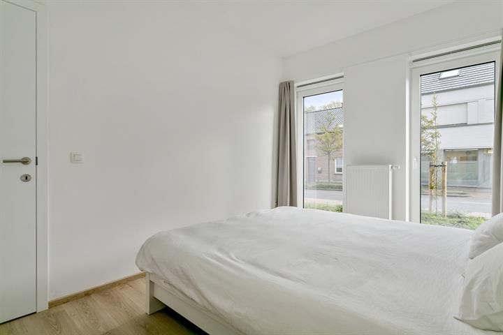 Gelijkvloers appartement met terras en tuintje foto 21