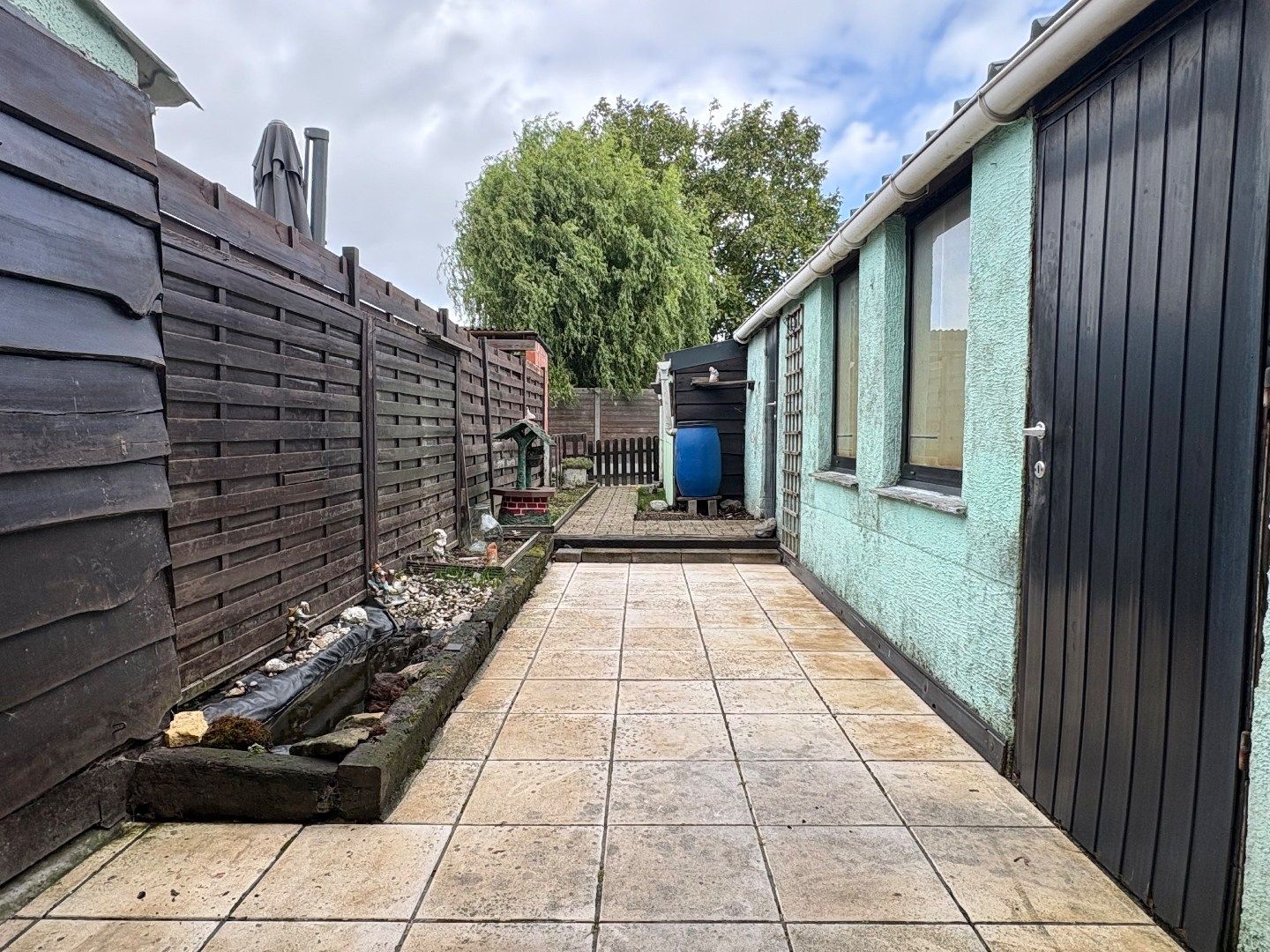 Te renoveren woning met 4 slaapkamers, tuin, uitweg en garage te koop in Harelbeke foto 14