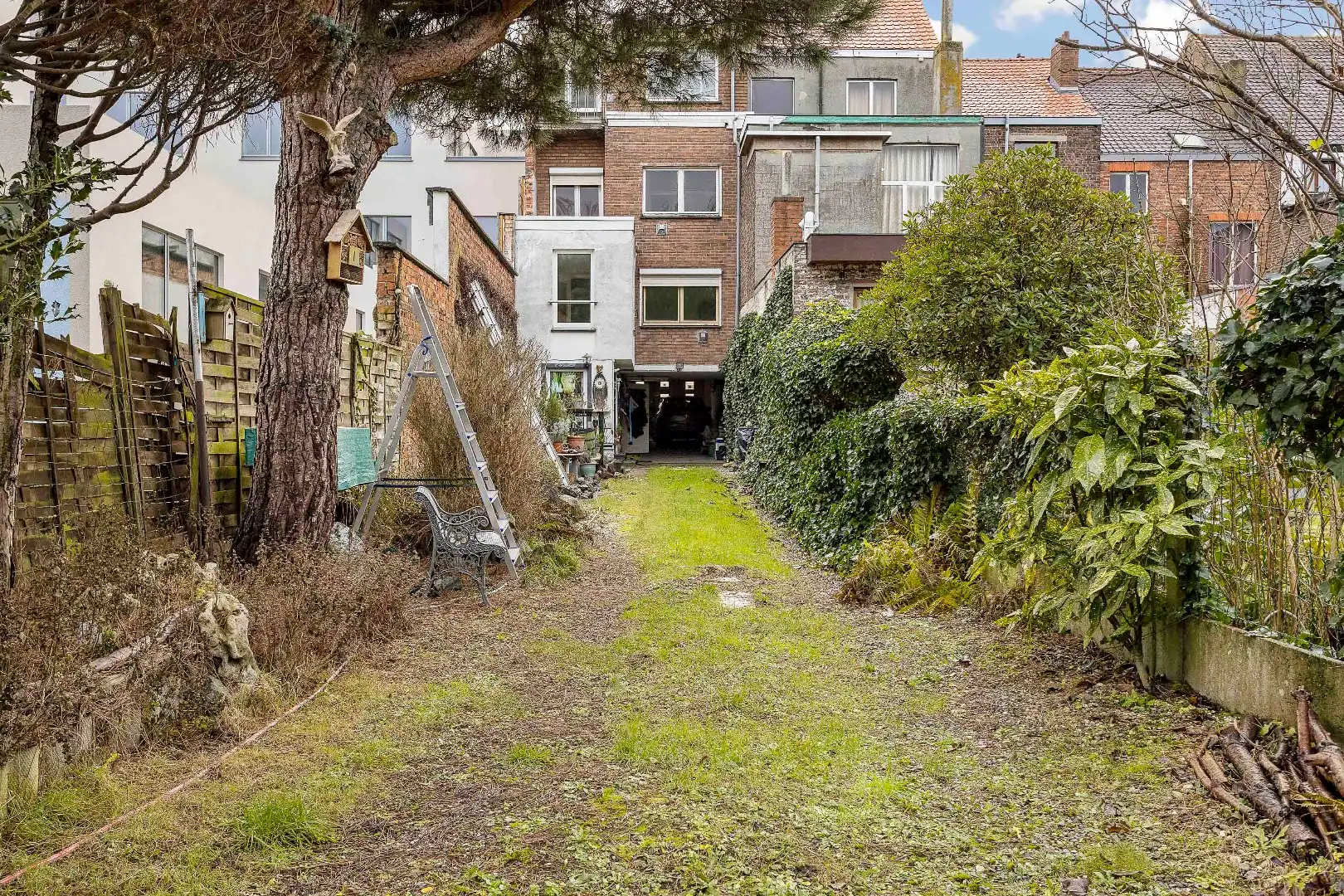 Te renoveren opbrengsteigendom met twee appartementen, parkings en tuin foto 20