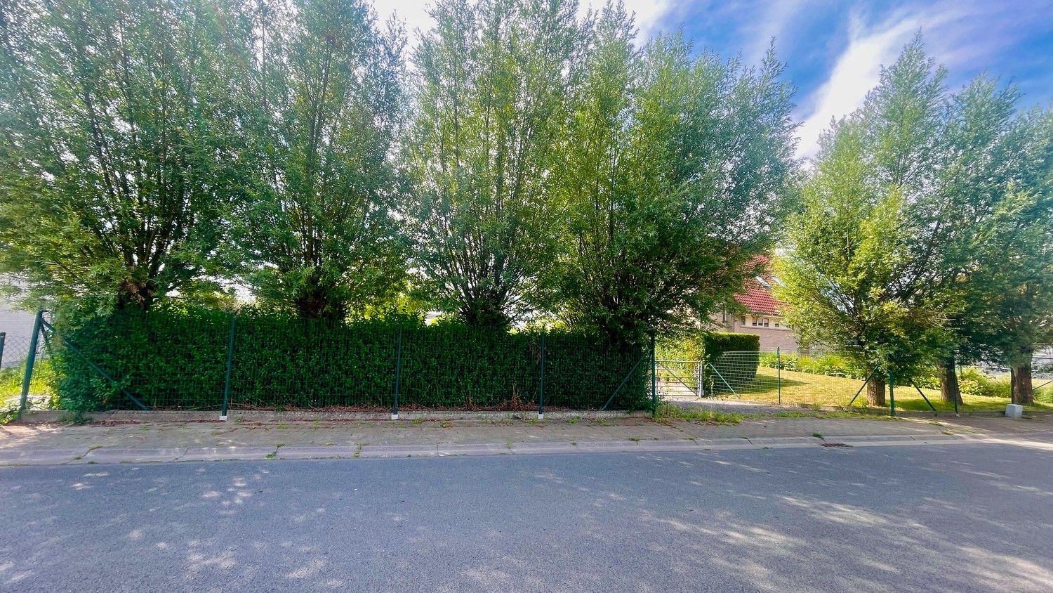 Bouwgrond van 1.264 m² te koop in groene omgeving – Ruddervoorde foto {{pictureIndex}}