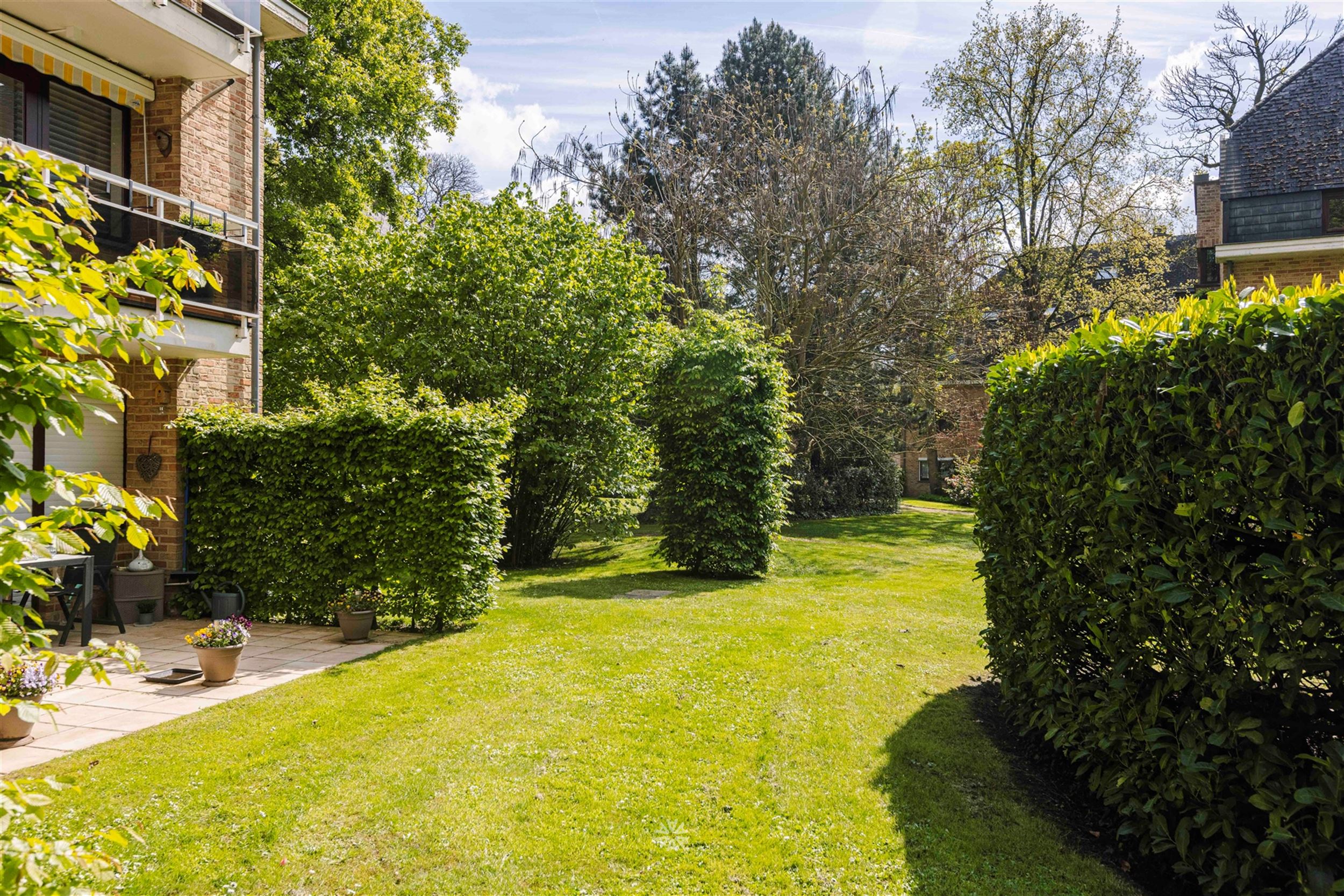 Gelijkvloers appartement met terras op exclusief domein te koop in Heusden foto 18