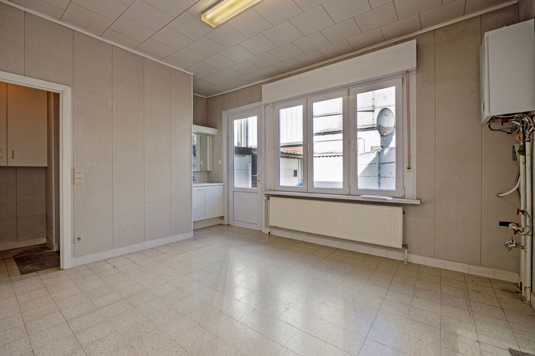 Handelshuis, ingedeeld als commerciële ruimte + appartement foto 5