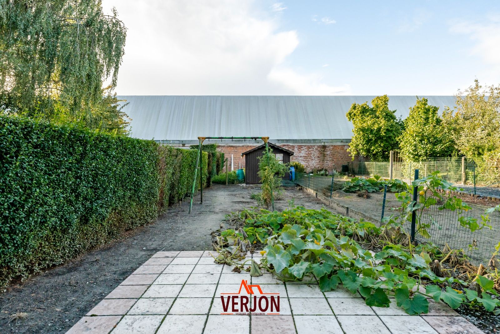 Charmante woning met ruime tuin te koop op het dorpsplein in Kachtem! foto 18