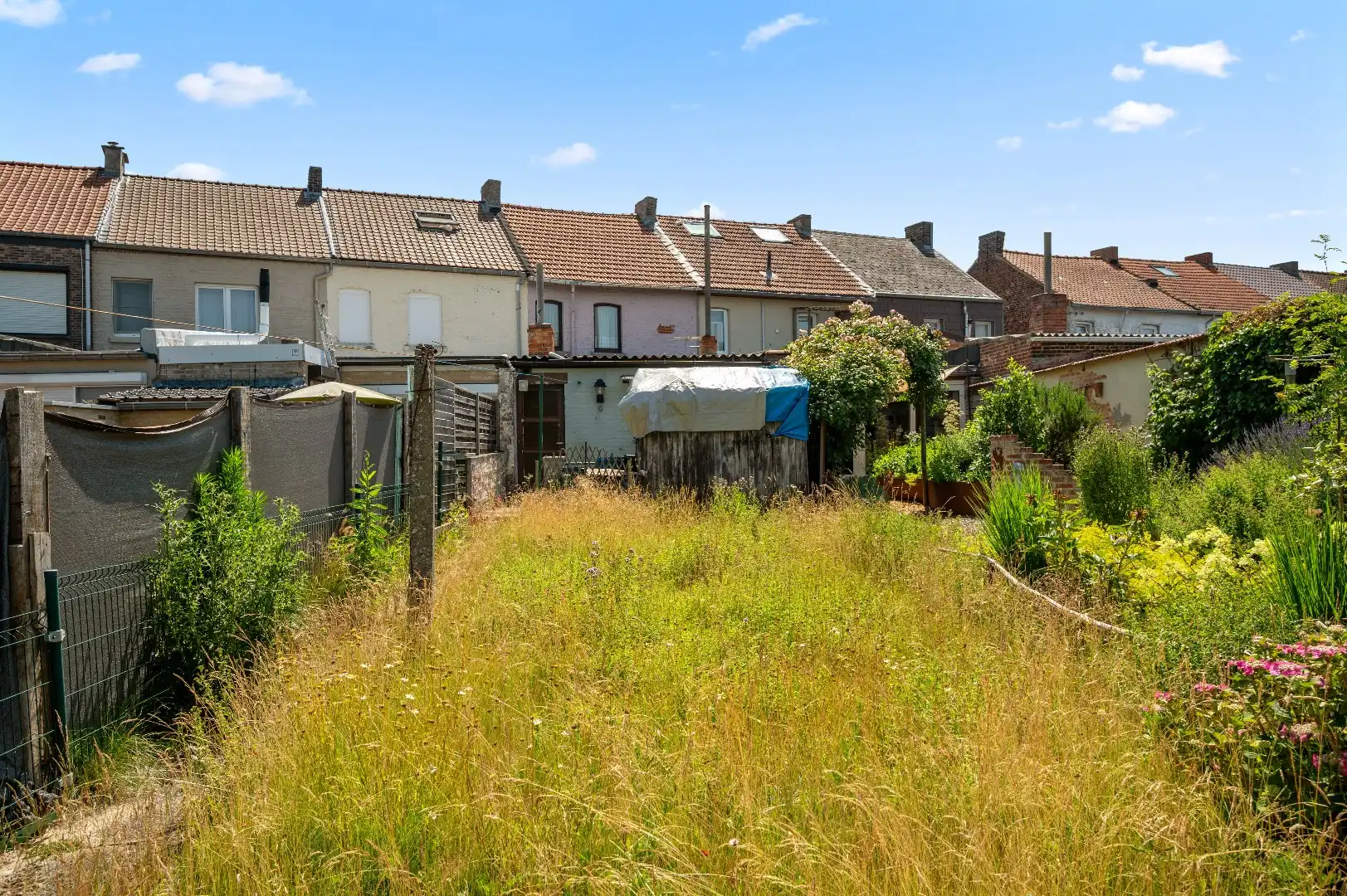 Te renoveren rijwoning in Attenhoven met tuin, garage en 3 slaapkamers foto 2
