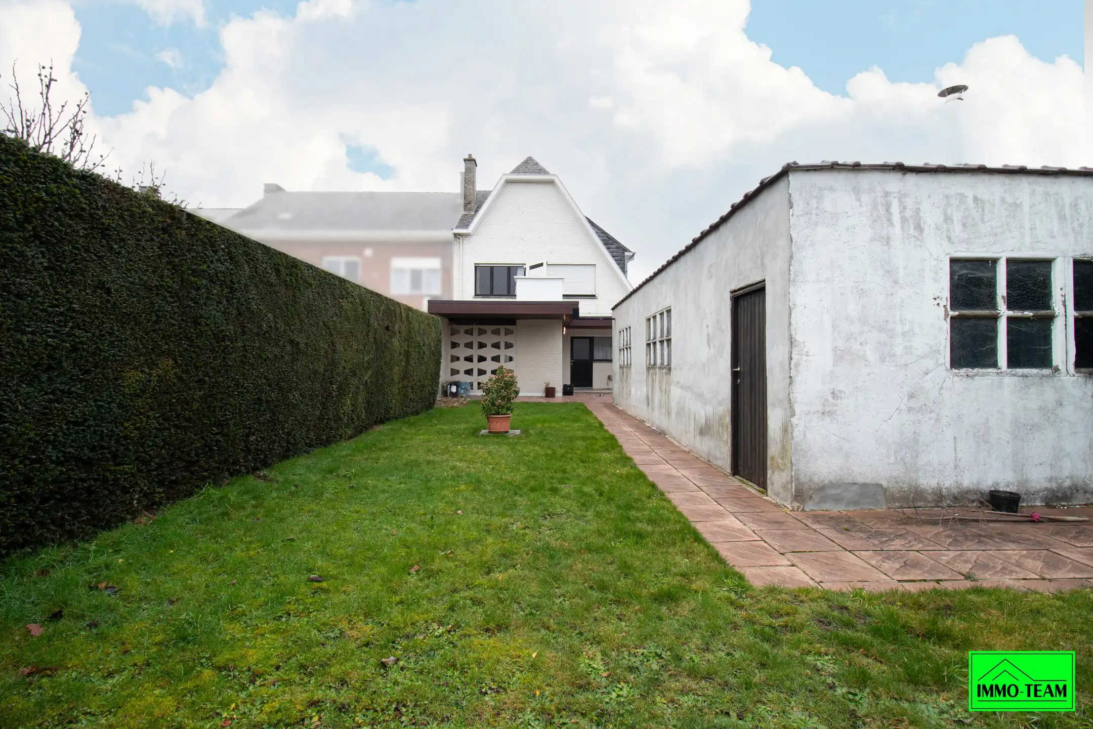 Goed onderhouden 3-gevelwoning met 3 slks, tuin en garage foto 21
