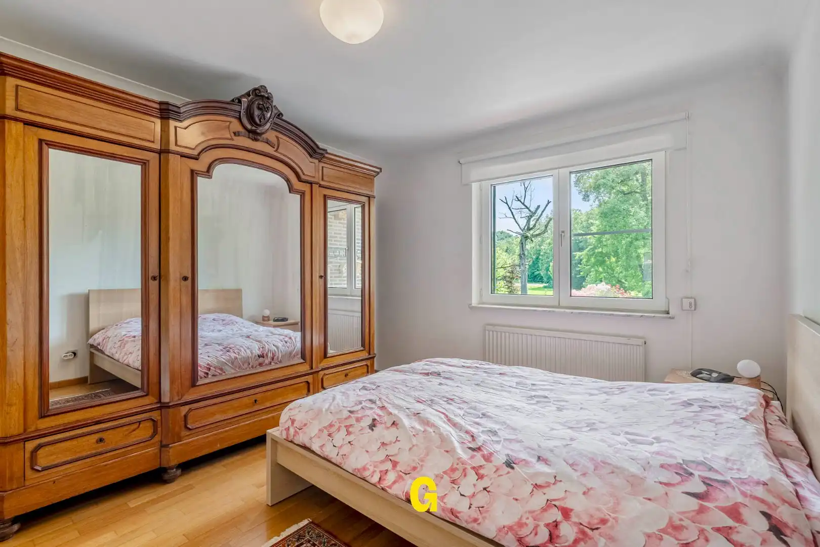 Uitstekend verzorgd 2-slaapkamer appartement in hartje Bilzen, met standplaats, kelderberging en terras met zicht op het Park van Haffmans foto 21