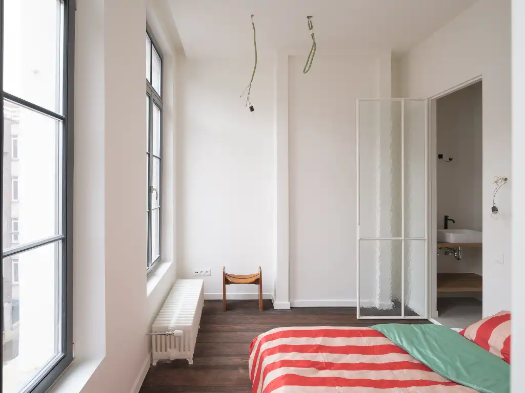 Gerenoveerd tweeslaapkamerappartement met zonnig terras in een voormalige herenwoning, nabij het historisch centrum van Gent. foto 10