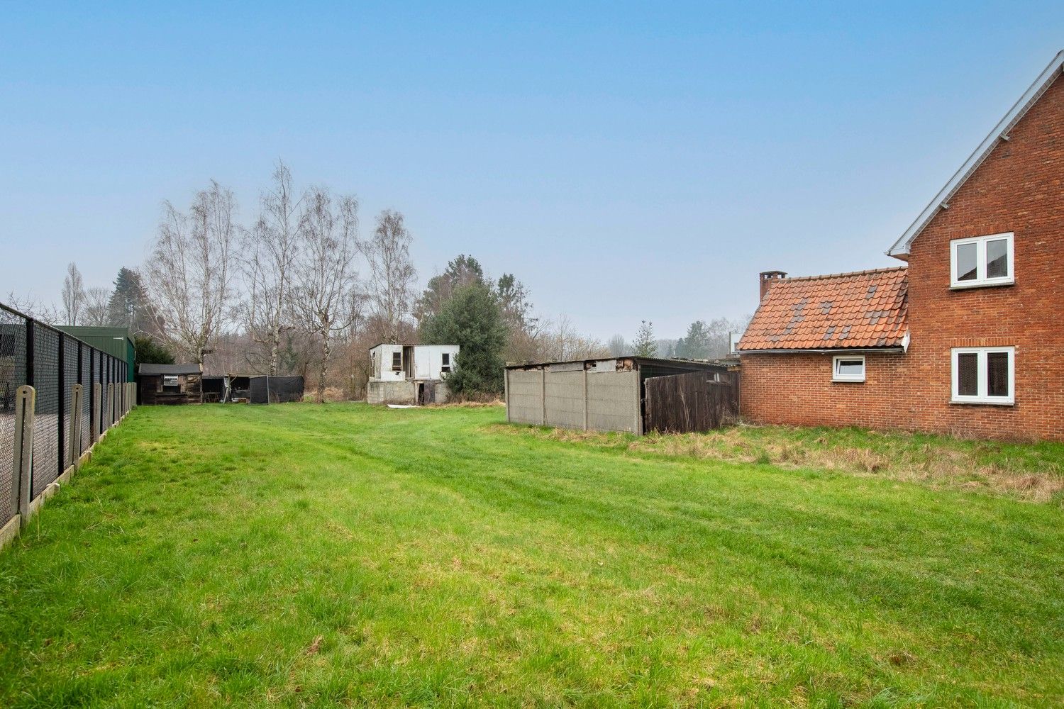 Te renoveren woning met veel mogelijkheden op een ruim perceel van 32a40ca te Lanaken! foto 8