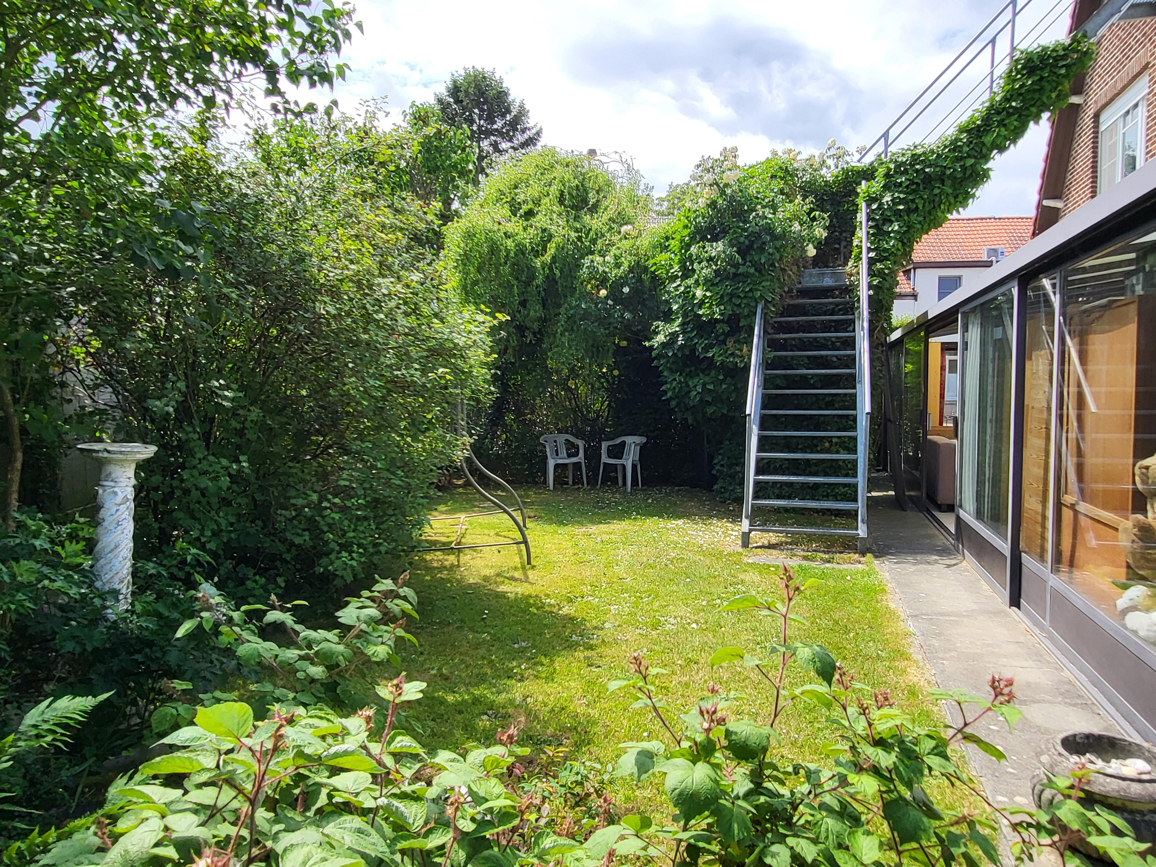 Charmante open bebouwing op 488m² met mooie aangelegde tuin.  foto 6