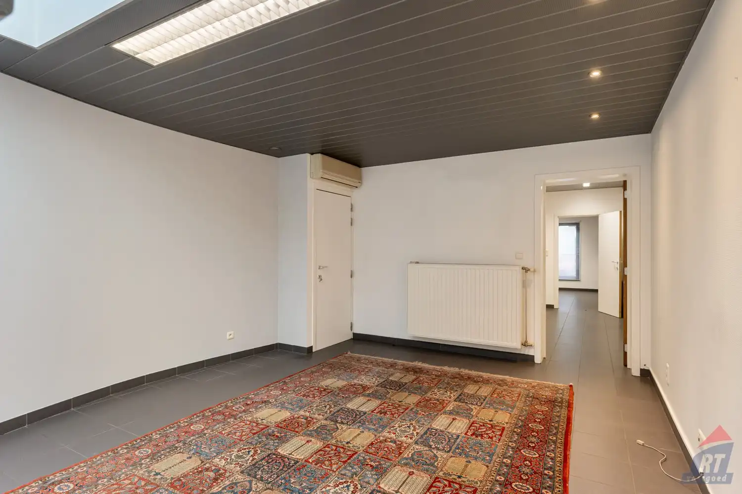 Veelzijdig pand met praktijkruimte en duplex appartement op toplocatie in Sint-Truiden foto 8