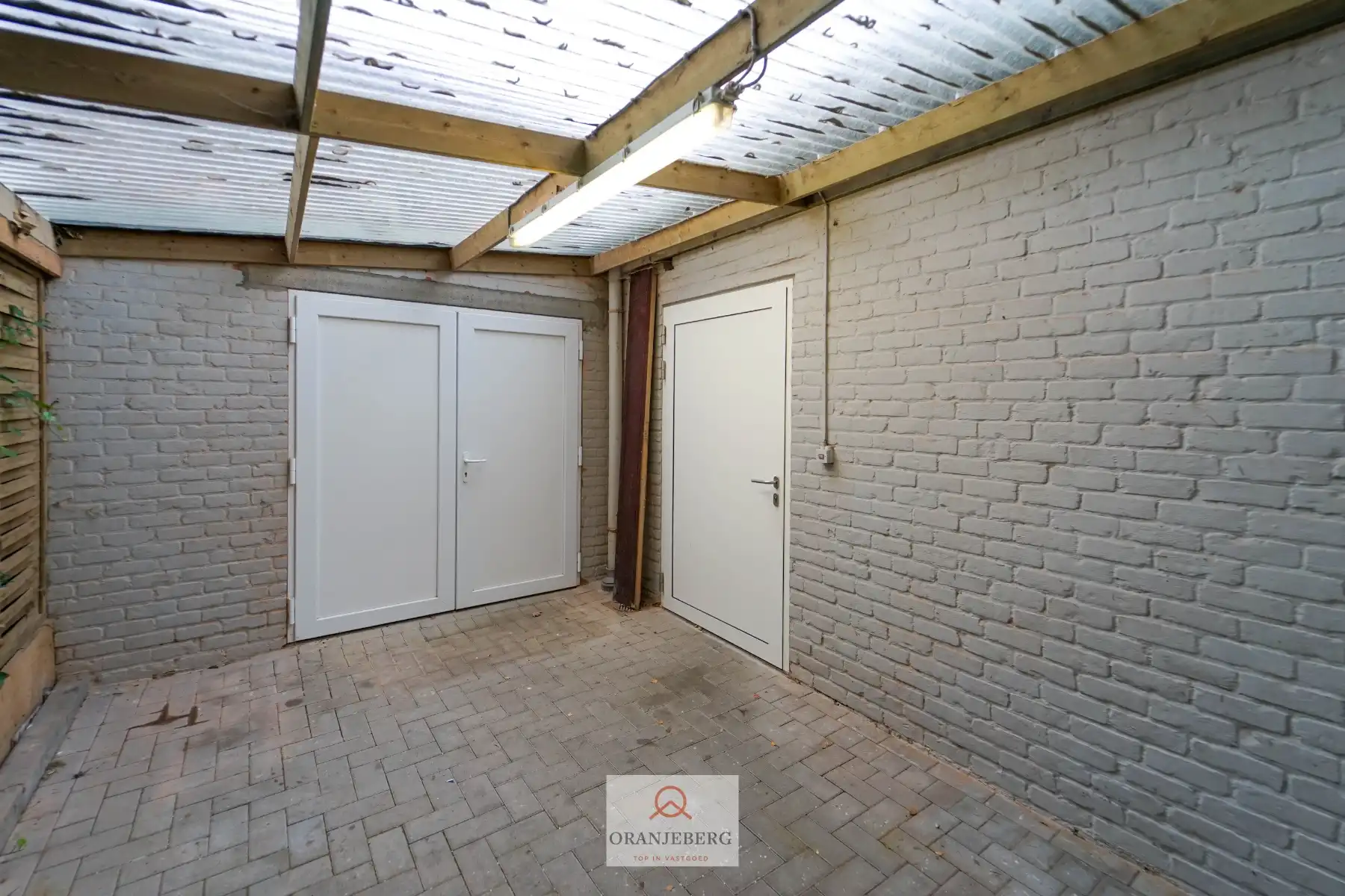 Ruim handelspand met meerdere ruimtes en parking te huur in centrum Drongen foto 15