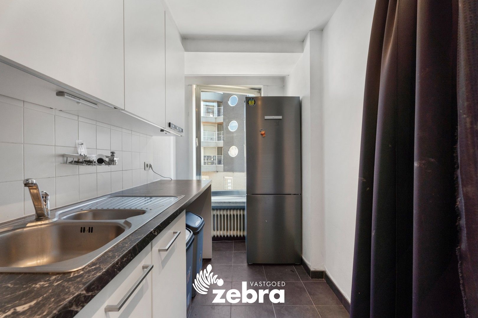 Instapklaar één-slaapkamerappartement in hartje Roeselare! foto 8