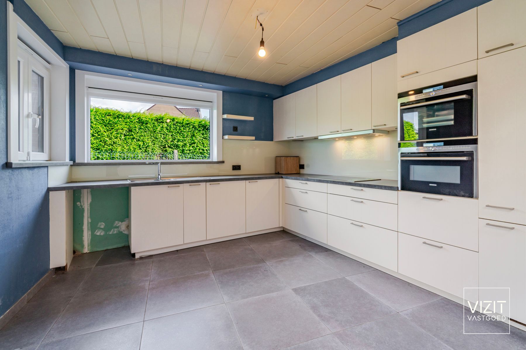 Zeer ruime halfopen woning aangename tuin foto 7