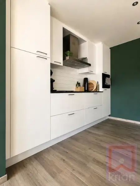 Volledig instapklaar gelijkvloers appartement met 2 slaapkamers, ruime tuin én garagebox foto 7