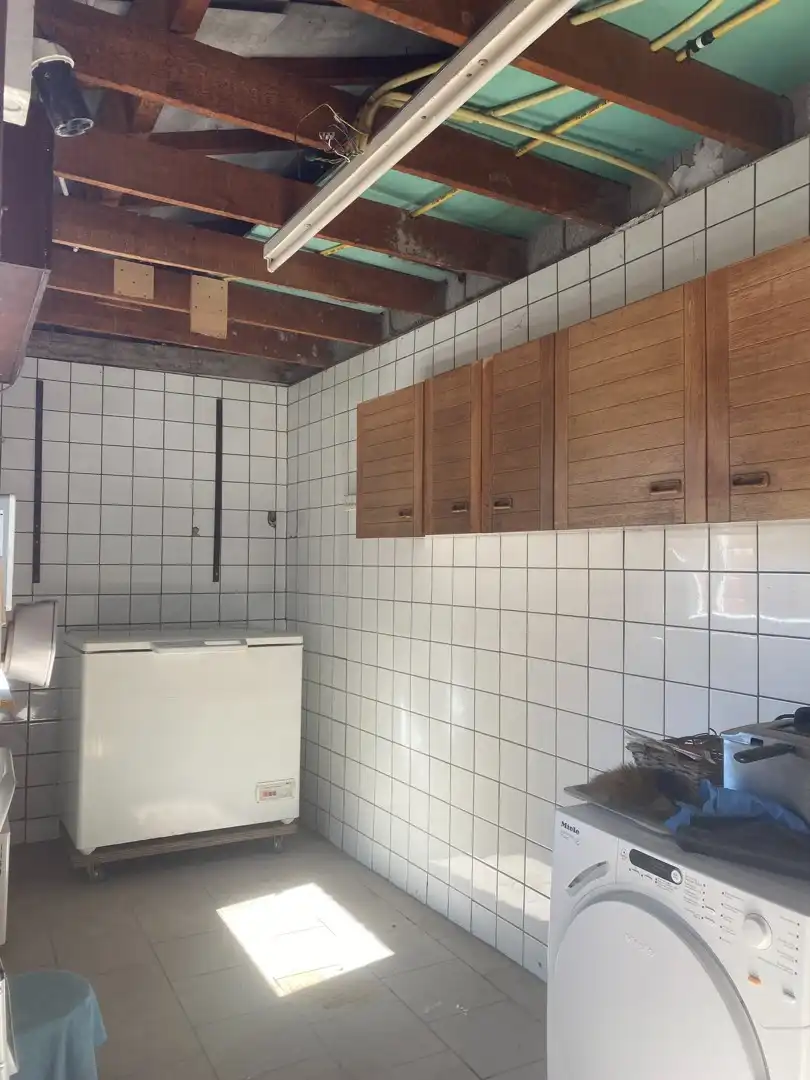 Centraal gelegen te renoveren woning met ruime garage en achterliggende tuin foto 12