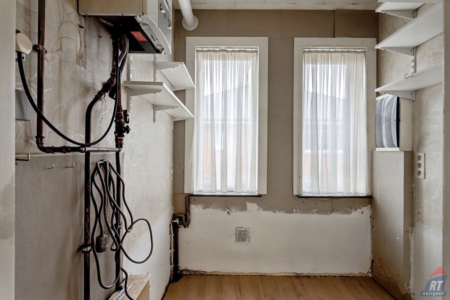 Gelijkvloerse halfopen woning met tuin en renovatiepotentieel in het hart van Sint-Truiden foto 14