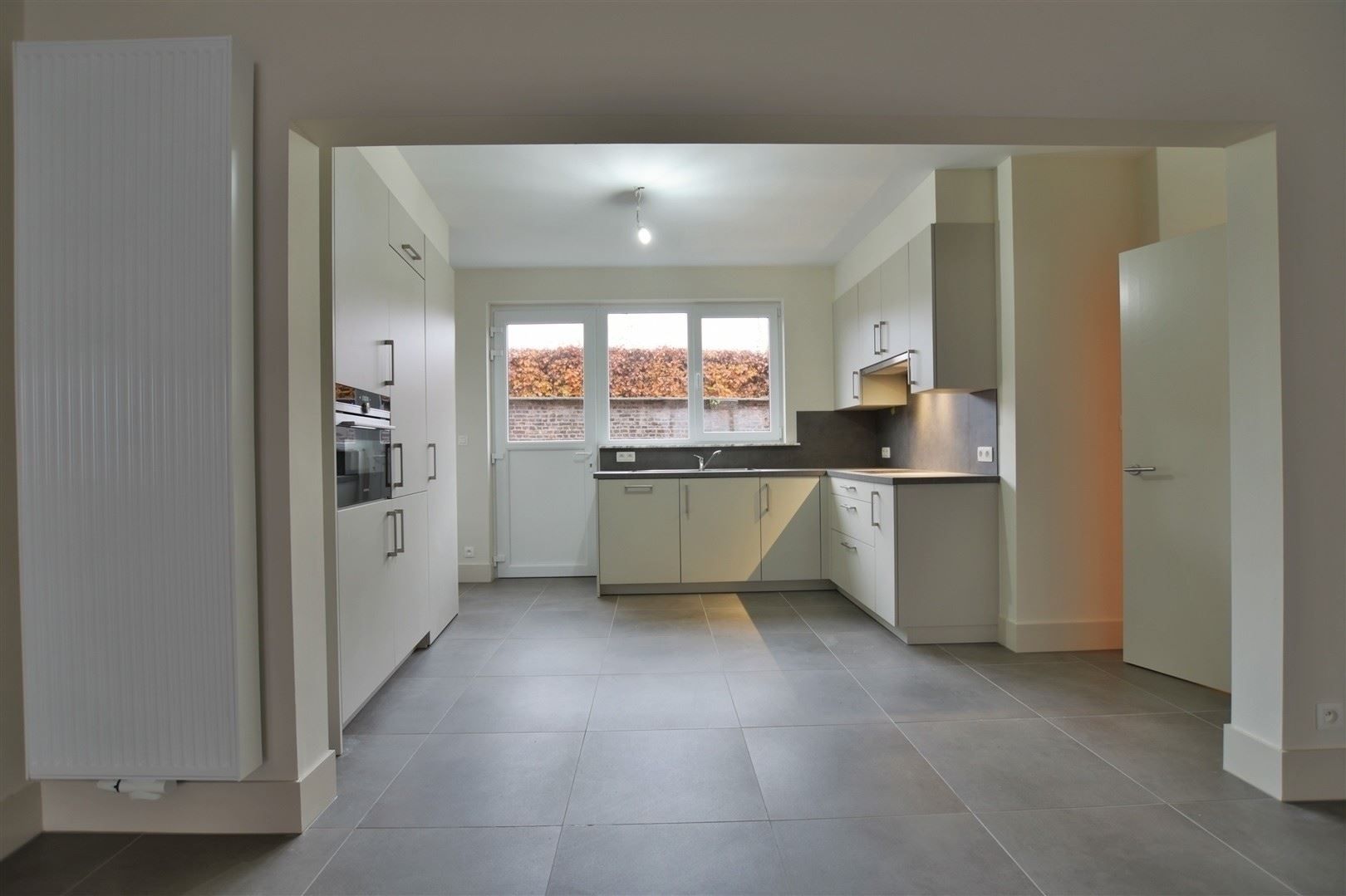 Totaal gerenoveerd GV appartement met tuin te Grembergen foto 16